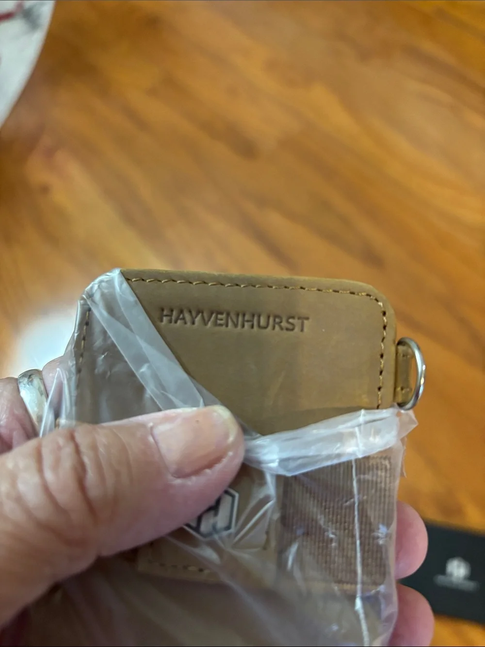 Men's wallet holds 12 cards and has a money clip